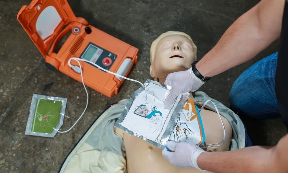 A Medical Professional Using an AED on a model