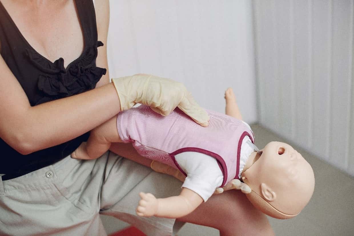 Step 6 & 7 | Place 2 Fingers on the infant’s chest and Give 5 firm chest compressions