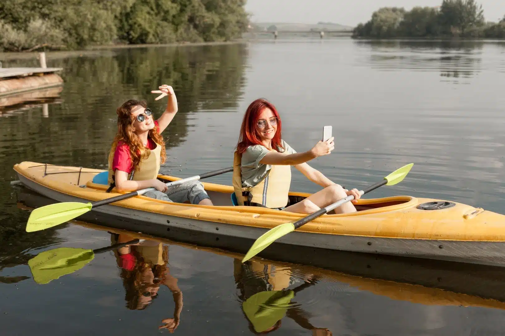 Women taking a selfie while kayaking in Lake Ontario